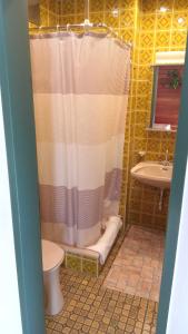 a bathroom with a shower with a toilet and a sink at Privatzimmer Bundschuh in Amlach +39 photos