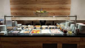 a buffet line with many different types of food at Akzent Hotel Oberhausen in Oberhausen