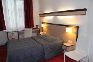 Postel nebo postele na pokoji v ubytování Hôtel de la Meuse