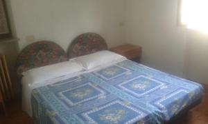 Postel nebo postele na pokoji v ubytování Albergo Bar Brenve
