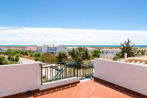 a balcony with a view of the ocean at For Sea Apartment in Cabanas de Tavira