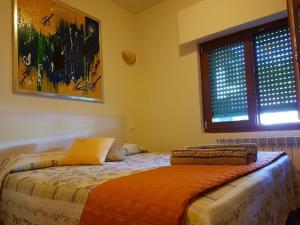 Voodi või voodid majutusasutuse Cadorna Chalet toas