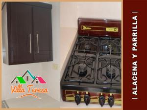 Nhà bếp/bếp nhỏ tại Departamentos & Suites Villa Teresa