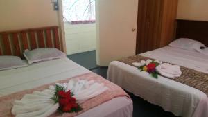 Katil atau katil-katil dalam bilik di Samoa Home