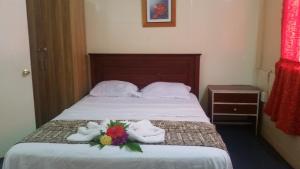 Katil atau katil-katil dalam bilik di Samoa Home