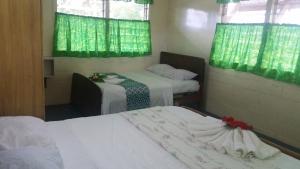 Katil atau katil-katil dalam bilik di Samoa Home