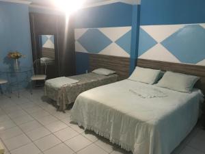 Postel nebo postele na pokoji v ubytování Hotel Porthal da Ilha- Paulo Afonso-Ba