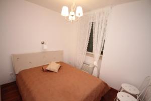 Postel nebo postele na pokoji v ubytování Dolce Vita Apartment