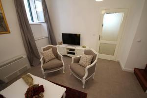 TV a/nebo společenská místnost v ubytování Dolce Vita Apartment