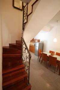 a staircase leading to a kitchen and a dining room at Dolce Vita Apartment in Dubrovnik