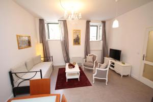 TV a/nebo společenská místnost v ubytování Dolce Vita Apartment