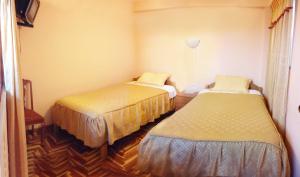 Katil atau katil-katil dalam bilik di Hostal Lucerito