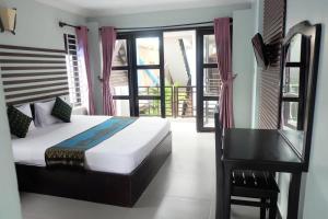 Ένα ή περισσότερα κρεβάτια σε δωμάτιο στο VIBOLA Guesthouse