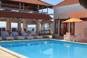 Bazén v ubytování Villa Agung Beach Inn nebo v jeho okolí