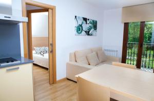 Postel nebo postele na pokoji v ubytování Apartahotel Castejón de Sos