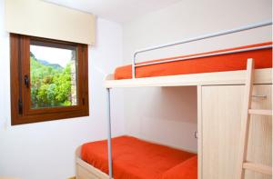 Postel nebo postele na pokoji v ubytování Apartahotel Castejón de Sos