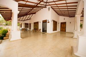 an open floor plan with a large room with a wooden ceiling at First House Mihintale in Mihintale