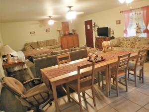 a living room with a wooden table and chairs at Charming Downstairs Unit in Oakhurst