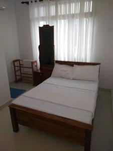 Tempat tidur dalam kamar di Himo Guest Inn