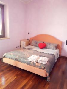a bedroom with a bed with two books on it at Terramadre in Itri +18 photos