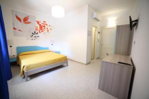 Postel nebo postele na pokoji v ubytování Hotel Albatros