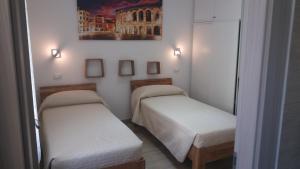 Postel nebo postele na pokoji v ubytování Vapama Rooms