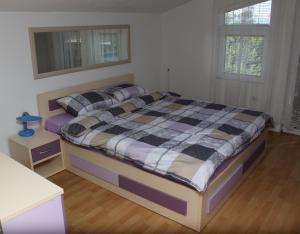 a bedroom with a large bed in a room at Mountain Villa Petkoski in Ohrid