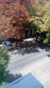 an overhead view of a street with trees and a car at Hostel Mlin Balkan in Skopje