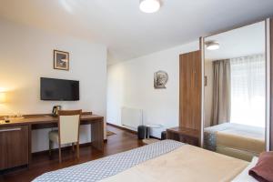 TV a/nebo společenská místnost v ubytování Residence Villa Karda