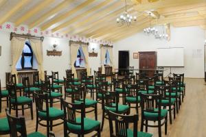 a room full of chairs in a room with a whiteboard at Conacul Maria Theresa in Orlat +101 photos