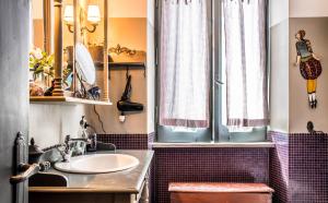 a bathroom with a sink and a mirror at Guest house Trevignano Romano in Trevignano Romano