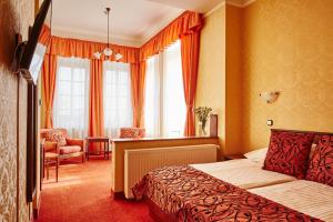 Postel nebo postele na pokoji v ubytování Hotel Astoria