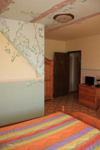 Postel nebo postele na pokoji v ubytování Agriturismo La Praduscella