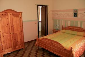 Postel nebo postele na pokoji v ubytování Agriturismo La Praduscella