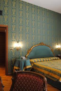 Postel nebo postele na pokoji v ubytování Park Hotel Villa Potenziani