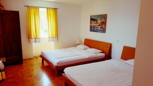 Ein Bett oder Betten in einem Zimmer der Unterkunft Apartments Panoramic