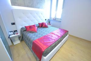 Voodi või voodid majutusasutuse Albergo Ardesio Da Giorgio toas
