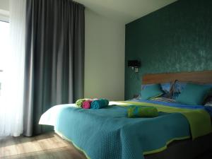 Posteľ alebo postele v izbe v ubytovaní Apartament z widokiem na morze - Apartament Turkusowy + 37 fotografií