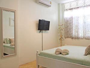 A bed or beds in a room at Lada House