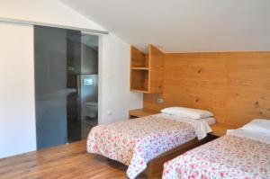 Postel nebo postele na pokoji v ubytování Apartments ALPA VITA