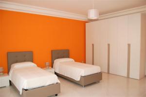 Кровать или кровати в номере L'appartamento