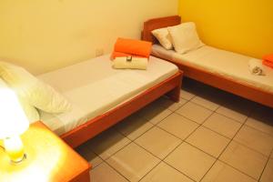 Krevet ili kreveti u jedinici u objektu El Viajero Asuncion Hostel & Suites