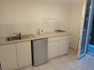 a kitchen with a sink and a counter top at Villa Jasmin Studios in Gouvia +15 photos