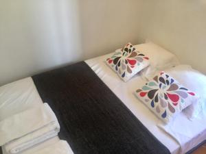 Posteľ alebo postele v izbe v ubytovaní Village House