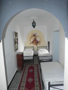 Postel nebo postele na pokoji v ubytování Riad Sijane