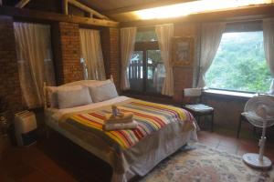 Postel nebo postele na pokoji v ubytování Jiufen Aromatherapy B&B