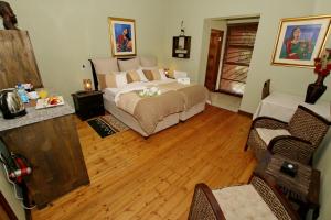 Säng eller sängar i ett rum på Summer Garden Guest House (The Palms)