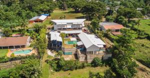 an aerial view of a house with a pool and a yard at Retreat Seaside in Port Vila