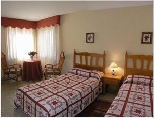 Postel nebo postele na pokoji v ubytování Hotel Toscana
