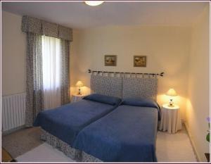 Säng eller sängar i ett rum på Hostal Toscana
